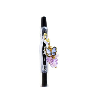 Butterfly lavender charm pen with enamel butterfly charm and purple bead accents on black Pilot Juice gel pen