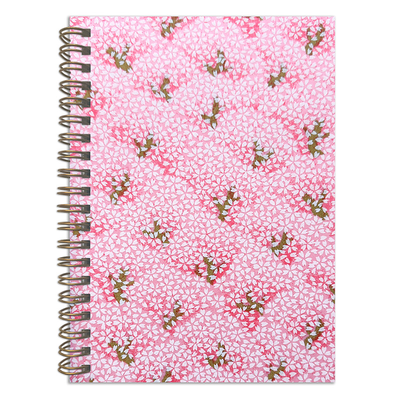 Sakurano washi notebook cover with scattered pink sakura blossoms and delicate branches on soft pink background