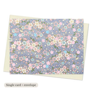 Yuka Gray Washi Note Card with scattered sakura blossoms in pink, blue, and cream on soft gray background with subtle gold accents
