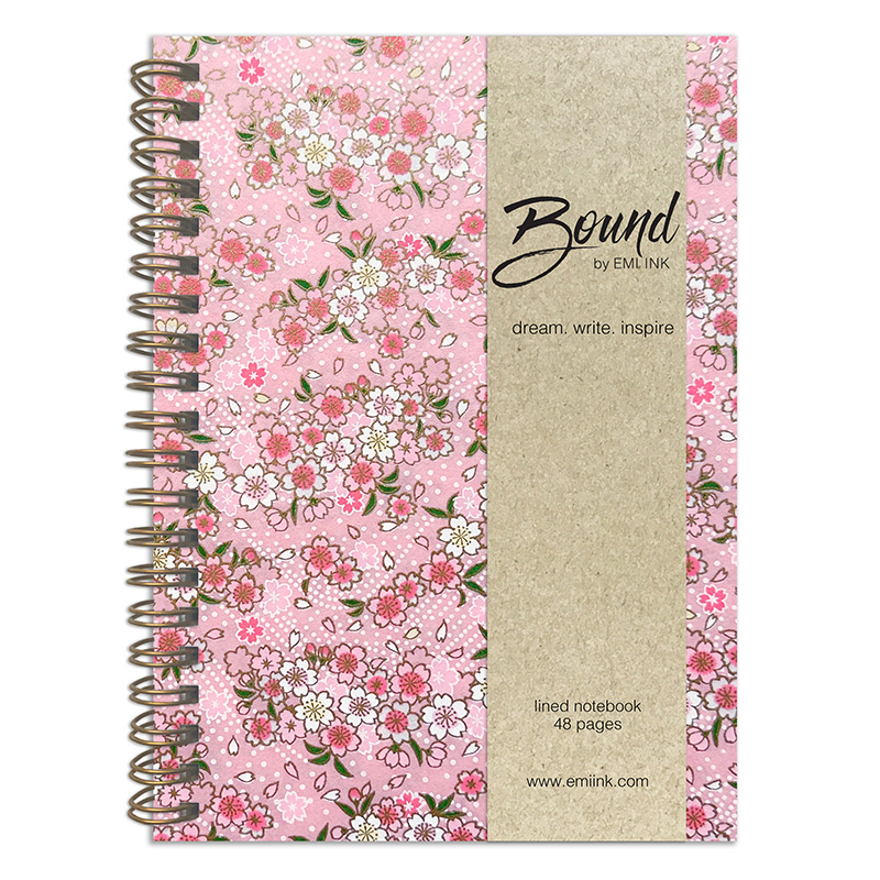 Yuka Pink Washi Notebook with scattered sakura blossoms in pink, blue, and cream on soft blush pink background