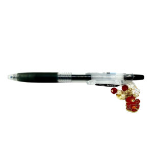 Monkey zodiac charm pen by love MIREI featuring an enamel monkey charm, red bead accents, and black Pilot Juice gel pen
