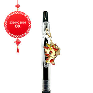 Close-up side view of Ox zodiac charm pen by love MIREI with enamel ox charm and coordinating bead accents