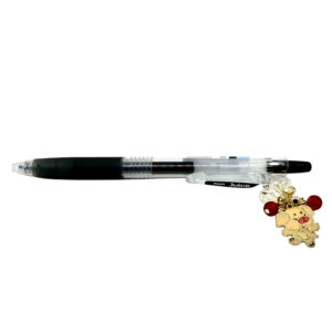 Pig zodiac charm pen by love MIREI featuring an enamel pig charm, red bead accents, and black Pilot Juice gel pen