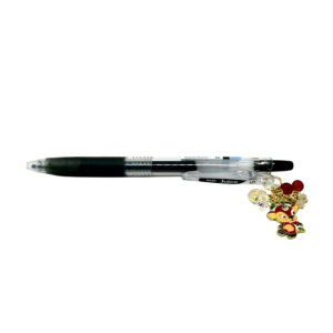 Ram zodiac charm pen by love MIREI featuring an enamel ram charm, red bead accents, and black Pilot Juice gel pen