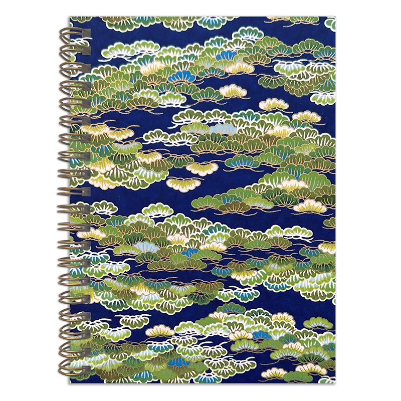 Matsukaze washi notebook showing green and gold pine pattern on deep navy Japanese chiyogami cover